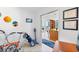 Hallway with a bicycle and golf clubs leads to an open living space with expansive windows and natural light at 175 1St S St # 1003, St Petersburg, FL 33701