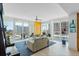 Bright living room featuring large windows with stunning city views and comfortable seating at 175 1St S St # 1003, St Petersburg, FL 33701