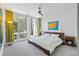 Relaxing bedroom with natural light, cityscape views, and a ceiling fan for added comfort at 175 1St S St # 1003, St Petersburg, FL 33701