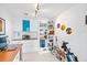 Bright office with built-in shelves, desk, and personal touches creates a functional and inspiring workspace at 175 1St S St # 1003, St Petersburg, FL 33701
