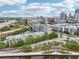 Beautiful aerial view of the condo community and skyline surrounded by lush greenery and city views at 201 Laurel # 308, Tampa, FL 33602