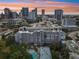 Stunning aerial view showcasing the building's architecture and downtown skyline at sunset at 201 Laurel # 308, Tampa, FL 33602