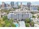 An aerial view of the condo highlighting a swimming pool and the surrounding skyline and roads at 201 Laurel # 308, Tampa, FL 33602