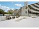 Community amenity deck featuring multiple gas grills, tables, and seating areas at 201 Laurel # 308, Tampa, FL 33602