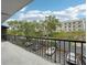 Balcony view overlooking a parking lot and lush greenery at 201 Laurel # 308, Tampa, FL 33602