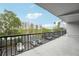 Spacious balcony view with seating area, palm trees and neighborhood at 201 Laurel # 308, Tampa, FL 33602