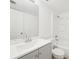 Bright bathroom featuring a vanity with gray cabinets and a shower-tub combination at 201 Laurel # 308, Tampa, FL 33602