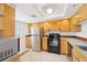 Kitchen with stainless steel refrigerator, black oven and tile flooring at 201 Laurel # 308, Tampa, FL 33602