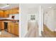 Bright kitchen with stainless steel dishwasher, and view to the living area with wood floors at 201 Laurel # 308, Tampa, FL 33602
