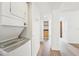 Laundry area in hall with stacked washer and dryer at 201 Laurel # 308, Tampa, FL 33602