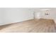 Open-concept living room with hardwood floors and abundant natural light near kitchen at 201 Laurel # 308, Tampa, FL 33602