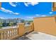 Residential balcony featuring yellow wall, stone railing and a view of the cityscape at 2226 Soho Bay Ct, Tampa, FL 33606