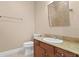 This powder room features a single vanity, mirror, and toilet at 2226 Soho Bay Ct, Tampa, FL 33606