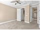 Upstairs bedroom with plush carpet, walk-in closet and view of attached bathroom at 2226 Soho Bay Ct, Tampa, FL 33606
