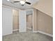 This cozy bedroom has a closet and access to another room at 2226 Soho Bay Ct, Tampa, FL 33606
