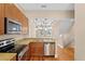 Open kitchen featuring stainless steel appliances, granite countertops, and a breakfast bar at 2226 Soho Bay Ct, Tampa, FL 33606