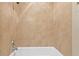 This tiled shower boasts a tub and shower head at 2226 Soho Bay Ct, Tampa, FL 33606