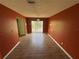 Dining room featuring hardwood floors and a sliding glass door leading to the backyard at 3206 Las Brisas Dr, Riverview, FL 33578