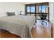 Bright bedroom with floor to ceiling windows offering city views and hardwood flooring at 3301 Bayshore Blvd # 2003D, Tampa, FL 33629