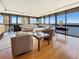 Bright living room with hardwood floors and expansive windows offering stunning water views at 3301 Bayshore Blvd # 2003D, Tampa, FL 33629