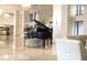 Bright lobby featuring a grand piano, elegant chandeliers, and comfortable seating at 3301 Bayshore Blvd # 2003D, Tampa, FL 33629