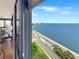 Water view featuring a living room and outdoor balcony overlooking a bay at 3301 Bayshore Blvd # 2003D, Tampa, FL 33629