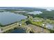 Expansive aerial view showcasing the property's location near tranquil lakes at 3610 Gulf City Rd, Ruskin, FL 33570