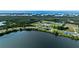Wide aerial view shows the property's location near the waterfront and the natural landscapes at 3610 Gulf City Rd, Ruskin, FL 33570