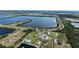 Aerial view of the property's location near a tranquil lake and surrounding landscapes at 3610 Gulf City Rd, Ruskin, FL 33570