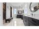 Spacious bathroom with double vanities, mirrors, tile floors, and a view of the outdoors at 3610 Gulf City Rd, Ruskin, FL 33570