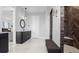 Bathroom featuring double vanities, tile flooring, and a beautifully tiled shower with a bench at 3610 Gulf City Rd, Ruskin, FL 33570