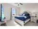 Comfortable bedroom featuring a plush bed, large window, and matching nightstands at 3610 Gulf City Rd, Ruskin, FL 33570