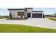 Beautiful modern home with a spacious driveway and well maintained landscaping at 3610 Gulf City Rd, Ruskin, FL 33570