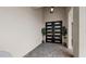 Modern home's entryway featuring a double front door, stone floor, and a minimalist design at 3610 Gulf City Rd, Ruskin, FL 33570