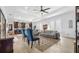 Open-concept living room connected to the kitchen, featuring stylish furniture and decor with tile flooring at 3610 Gulf City Rd, Ruskin, FL 33570