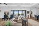 Elegant living room featuring an adjacent bar, pool view, modern decor, and comfortable seating at 3610 Gulf City Rd, Ruskin, FL 33570