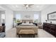Main bedroom with a seating area, king bed, and tray ceiling at 3610 Gulf City Rd, Ruskin, FL 33570