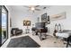 Bright office with neutral carpet, ceiling fan, dark furniture, decorative items and scenic views at 3610 Gulf City Rd, Ruskin, FL 33570