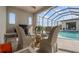 Poolside patio with a glass table and seating at 3610 Gulf City Rd, Ruskin, FL 33570