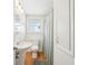 Cozy bathroom with pedestal sink, toilet, tub with shower, and ample lighting at 3611 4Th N Ave, St Petersburg, FL 33713