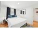 This bedroom features a cozy queen bed, wood floors, and a large mirror at 3611 4Th N Ave, St Petersburg, FL 33713
