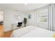 Well-lit bedroom with wood floors, a comfortable queen bed, and large window at 3611 4Th N Ave, St Petersburg, FL 33713