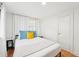 Bright bedroom featuring neutral walls, wood floor, and a comfortably sized queen bed at 3611 4Th N Ave, St Petersburg, FL 33713