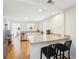 Well-lit kitchen with stainless steel appliances, a breakfast bar, and a seamless flow into the dining area at 3611 4Th N Ave, St Petersburg, FL 33713