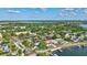 Beautiful aerial shot of neighborhood showing lush trees, landscaping, and waterway access at 4151 Sunrise S Dr, St Petersburg, FL 33705