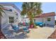 Outdoor patio with ample seating perfect for enjoying the pleasant surroundings at 4151 Sunrise S Dr, St Petersburg, FL 33705