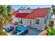 Back patio with comfortable outdoor seating, perfect for entertaining in the backyard at 4151 Sunrise S Dr, St Petersburg, FL 33705