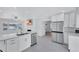 Modern kitchen with stainless steel appliances, quartz countertops, and an open floor plan at 4151 Sunrise S Dr, St Petersburg, FL 33705