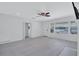 Open living room with sleek floors, neutral walls, and ample natural light highlighting the waterfront view at 4151 Sunrise S Dr, St Petersburg, FL 33705