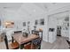 Spacious living space with table, seating, white walls and view to kitchen at 4151 Sunrise S Dr, St Petersburg, FL 33705